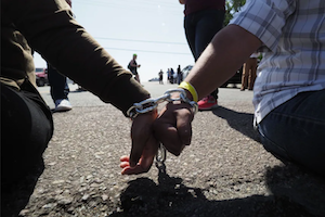 Two children's hands chained together